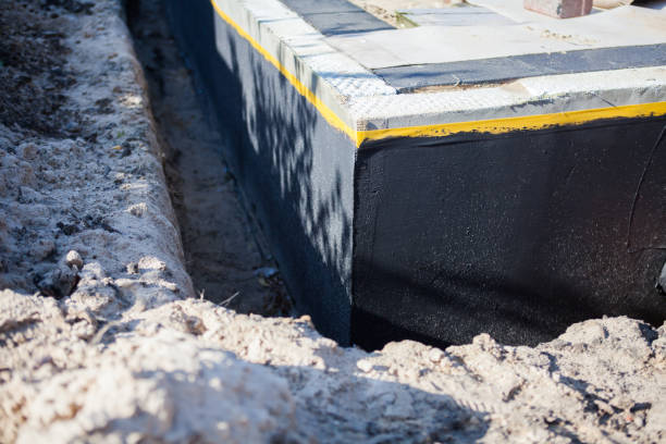 Professional Waterproofing technician working in Ottawa, KS